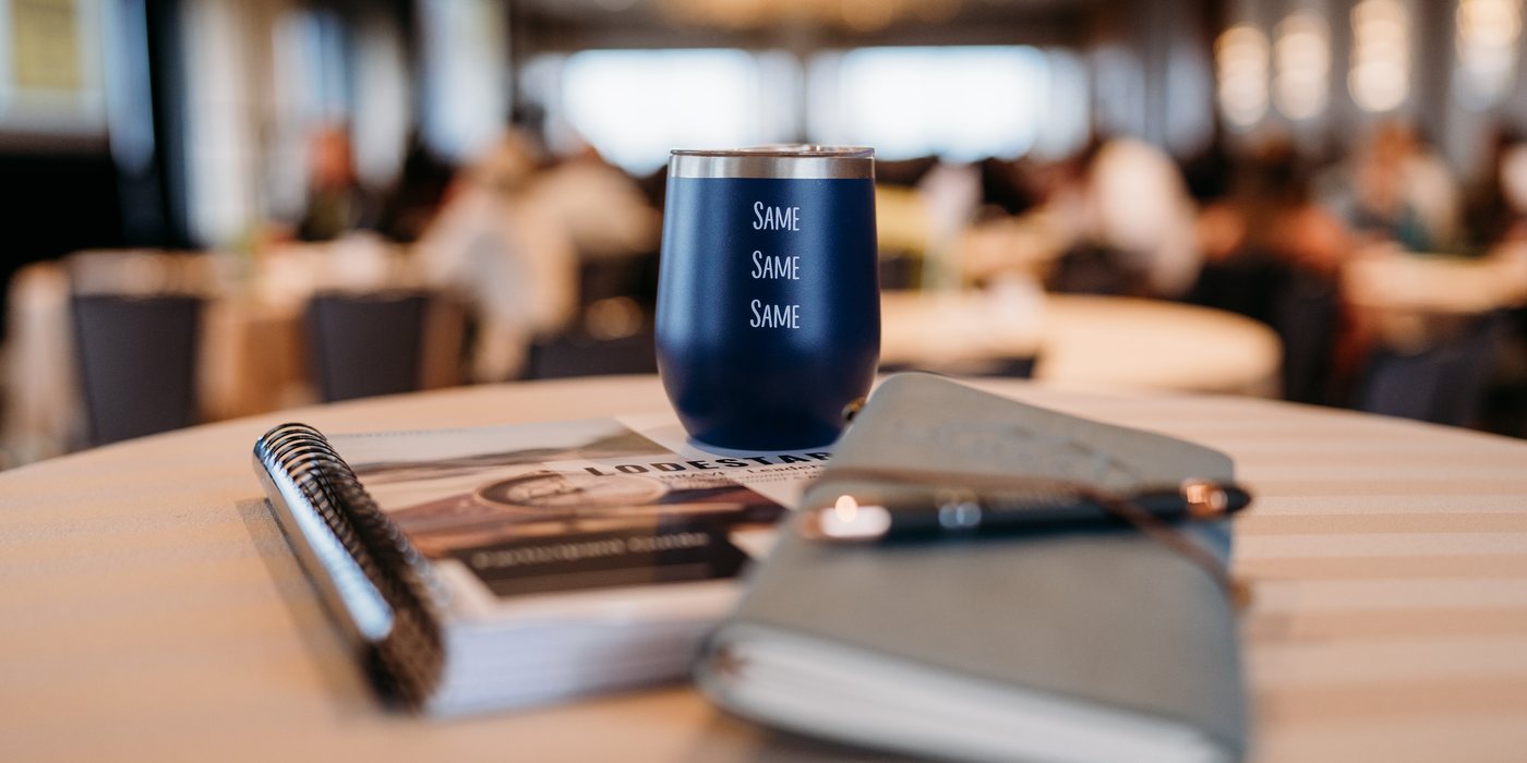Course materials and a notebook on a conference table